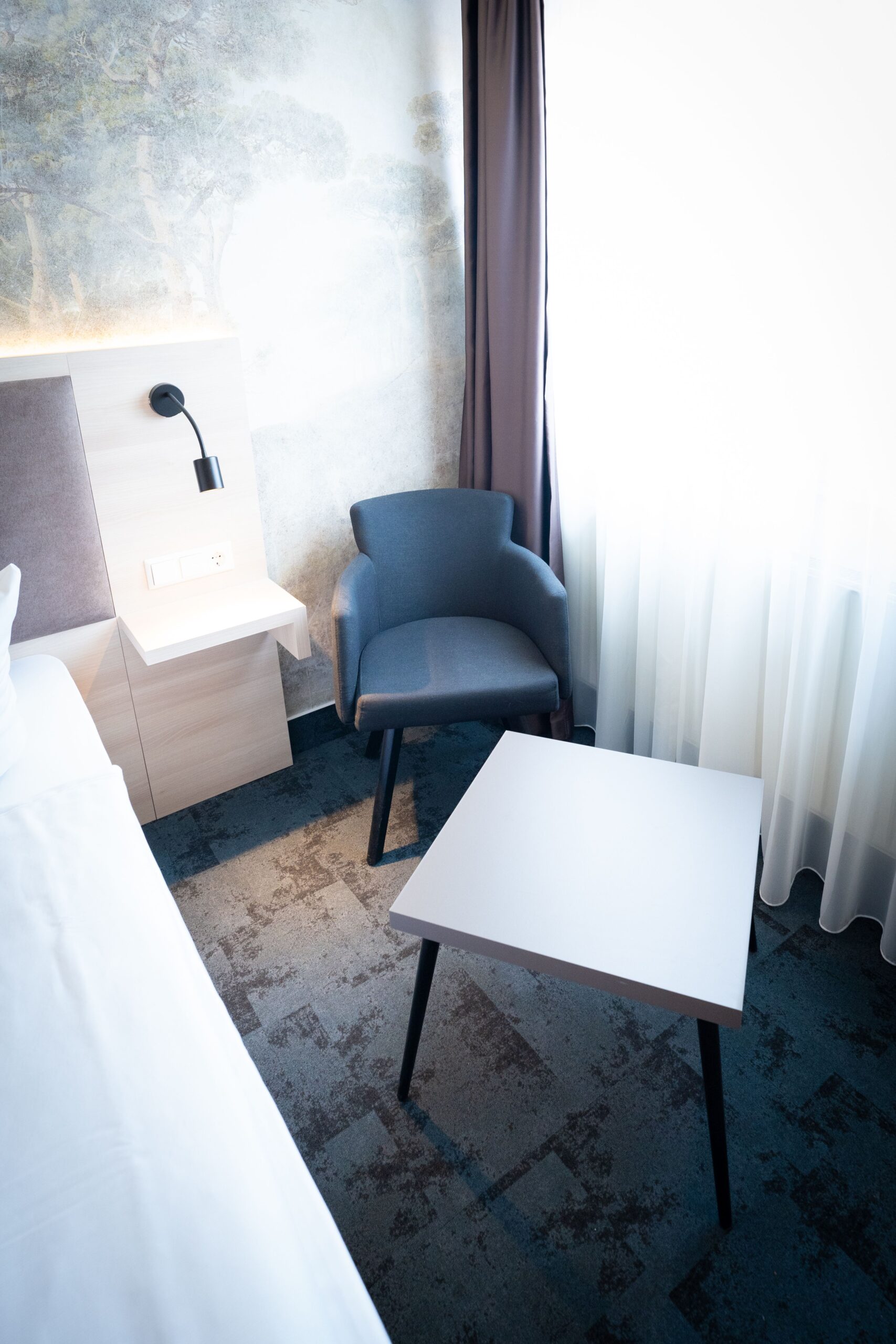 Hotel Lampertheim 37 exo hotel lampertheim room chair and table scaled